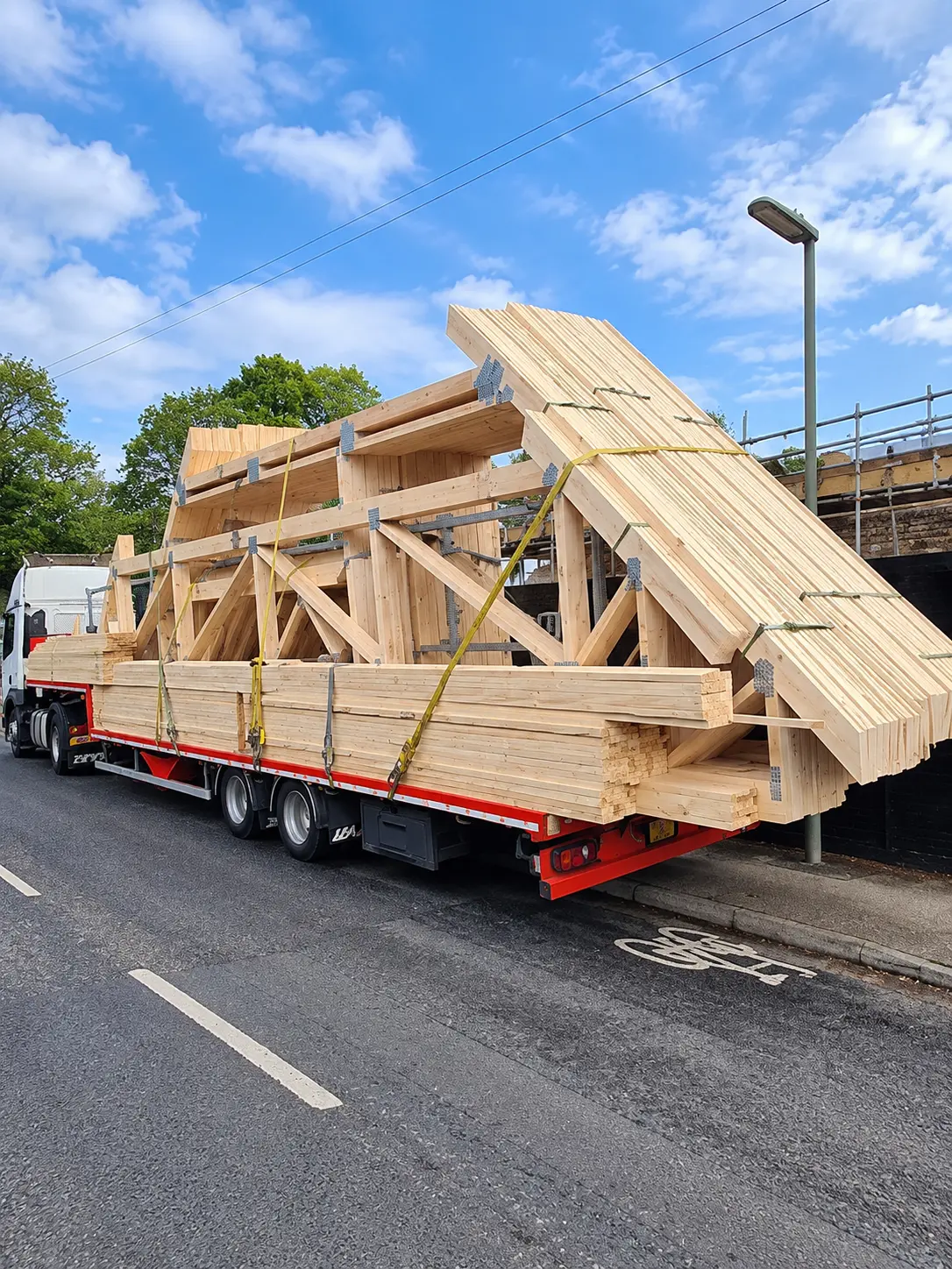 Prefabricated timber roof trusses delivered to site on a flatbed lorry