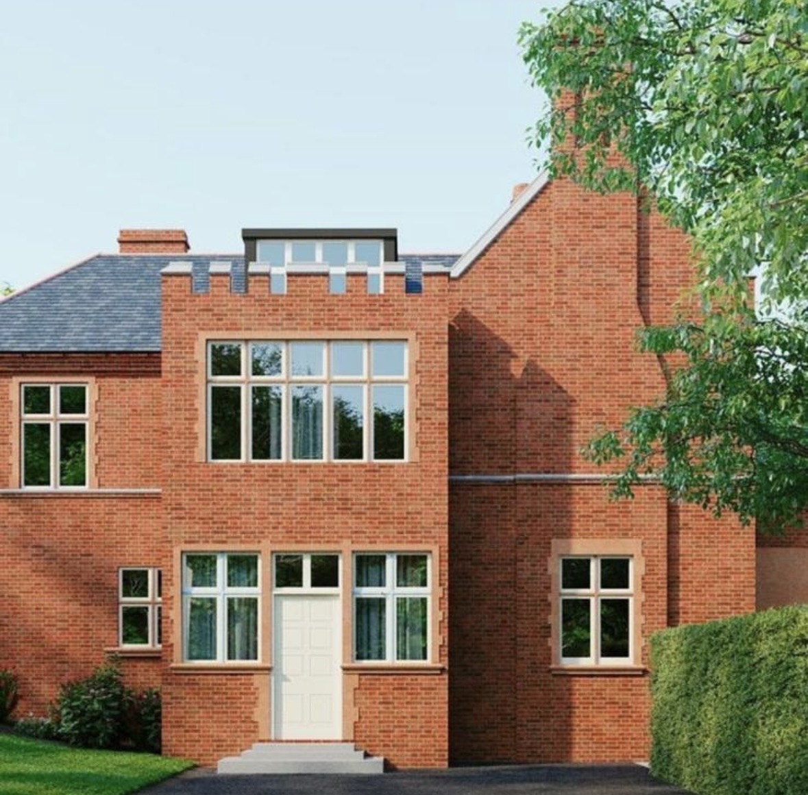 Red-brick apartment exterior with gabled section, stone window surrounds and garden hedge