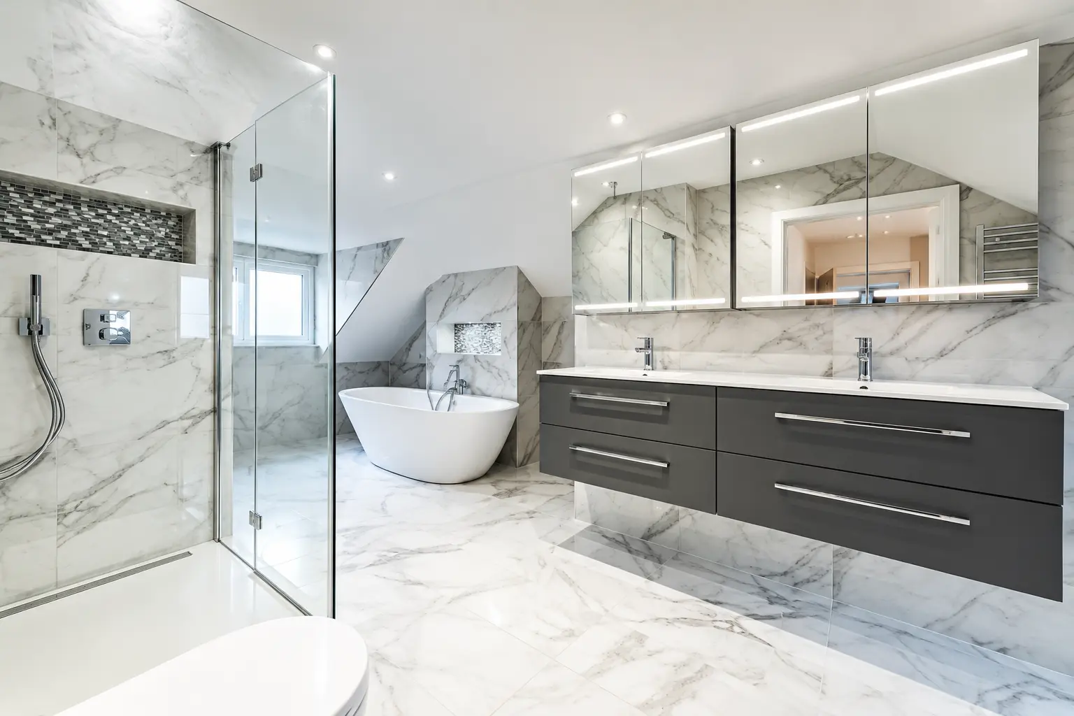 Marble-effect bathroom with walk-in shower, freestanding bath and floating vanity