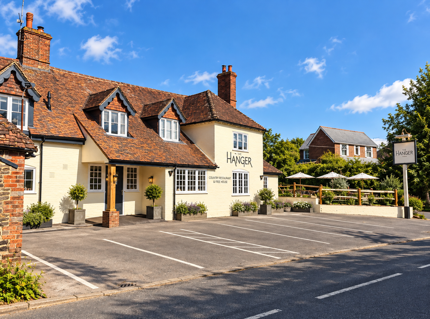 Refurbished traditional hospitality property with tiled roof and outdoor terrace